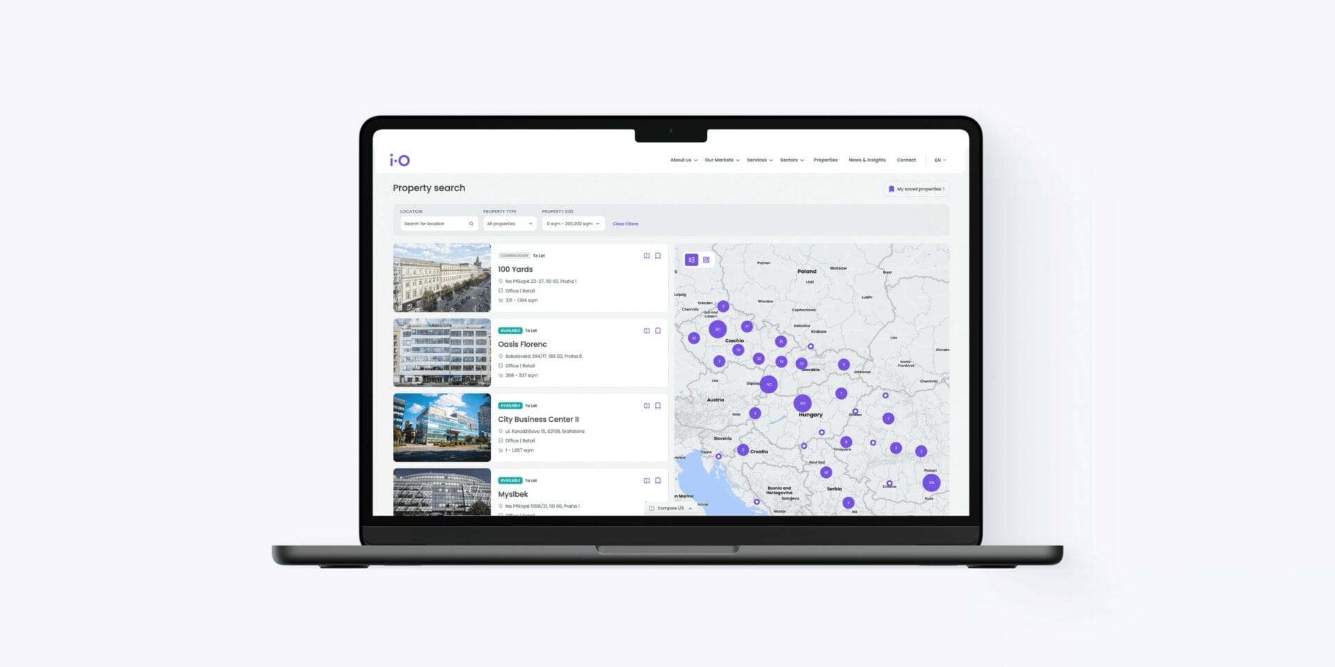 A laptop showing iO Partners property search: filters, office buildings in Prague and Bratislava and a map of Central Europe.