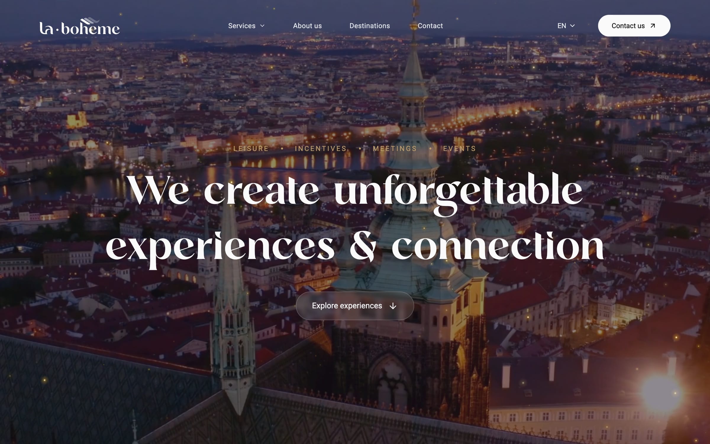 The same hero headline over dusk footage of Prague’s rooftops and a church spire, with points of warm light on the overlay.