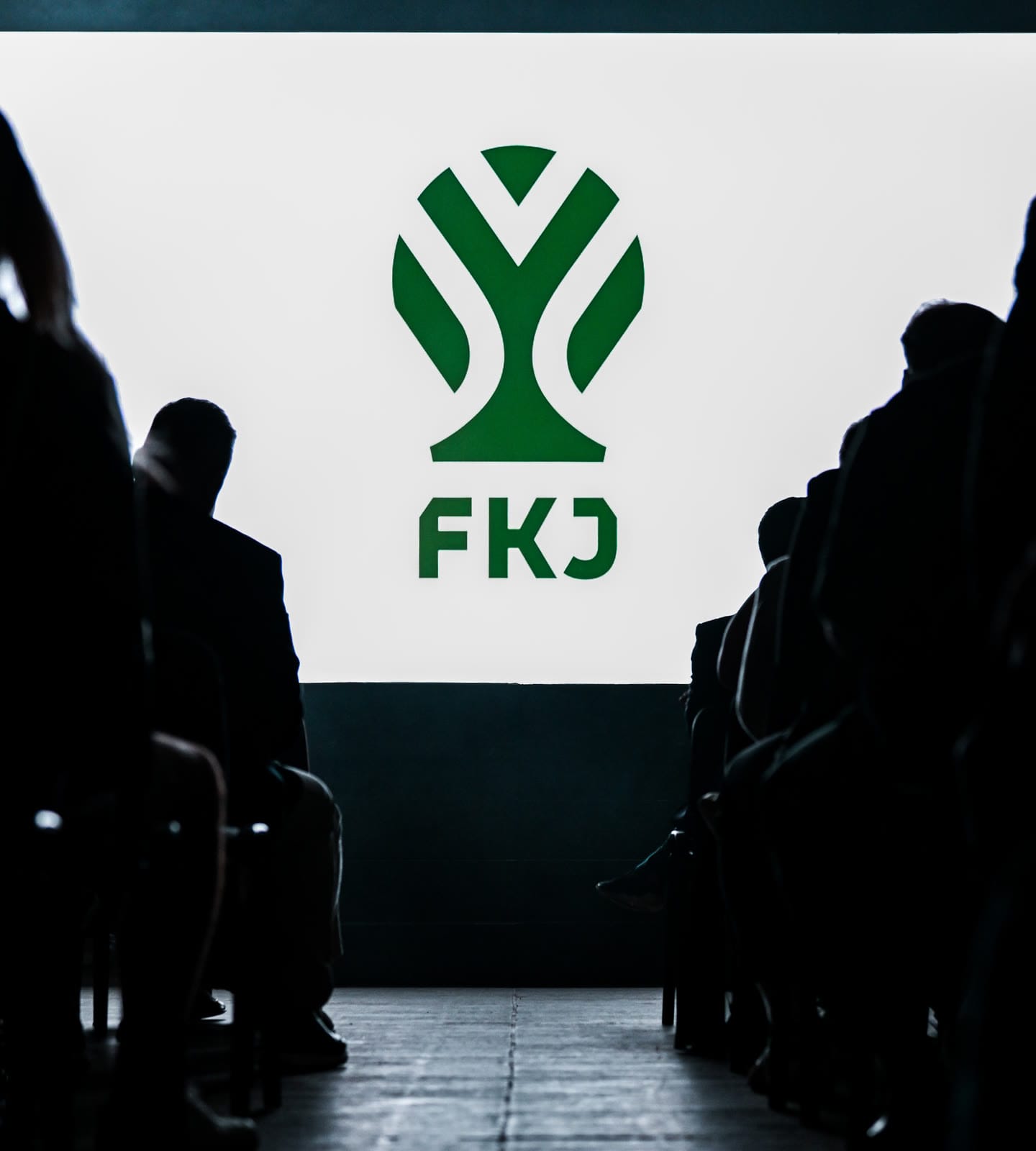 The new FKJ symbol on the big screen above an audience in silhouette at the reveal.