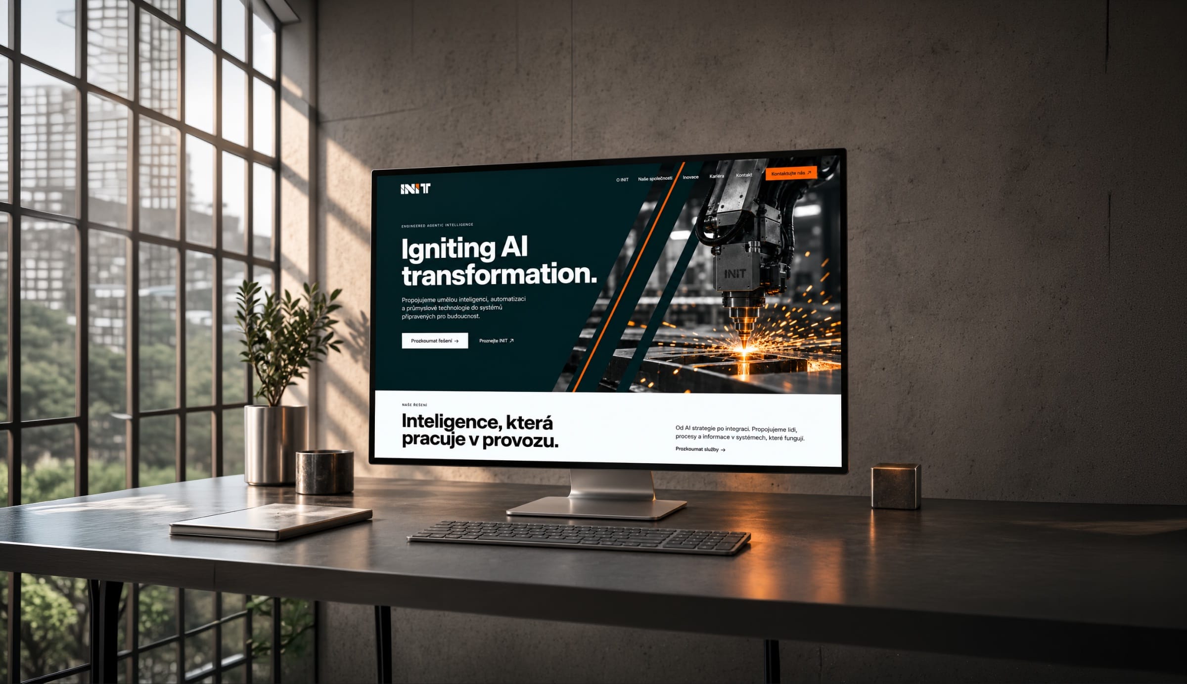 The INIT website on a desktop monitor in a concrete office: Igniting AI transformation over a machine throwing sparks.